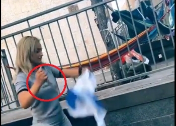 אי המתים: ערבייה צילמה את עצמה “שוחטת” את דגל ישראל. הסרטון: